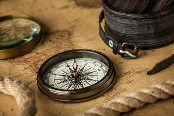 Fototapeta na wymiar Vintage compass on map