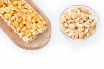 Honey bars with peanuts - white background. Top view