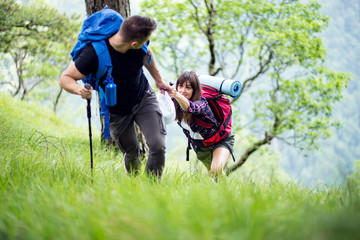 Fototapeta premium Couple enjoying on their hiking trip.Travel and adventure concept