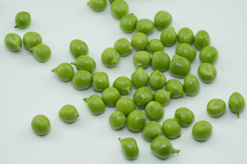 Fresh harvest green peas from my garden on white background 
