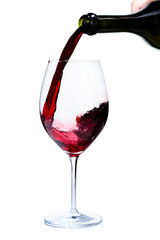 Alcoholic drink. Pouring expensive red wine from bottle