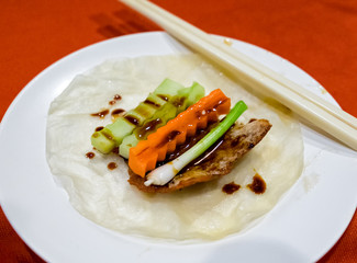 Peking duck roasted with carrot onion cucumber