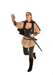 full length portrait of girl wearing brown medieval costume,. standing pose, isolated on white studio background.