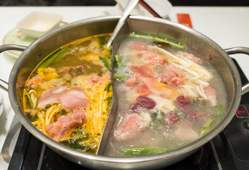 Shabu shabu cuisine meat with vegetable boiled in two soup