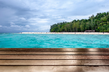 Wood table top on eautiful sea beach in bamboo island