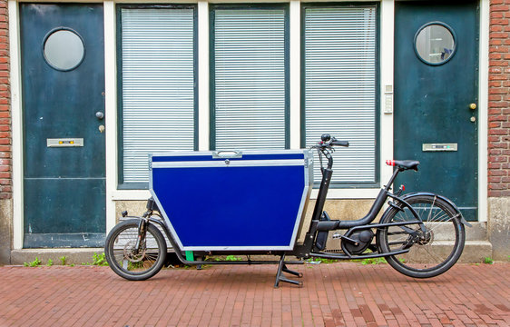 Fototapeta Fahrradkurier in Amsterdam