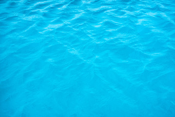 Fototapeta na wymiar Wave ripple turquoise blue surface of pool