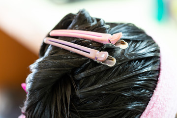 Background of Barber supplies, applying color cream at hair in salon.