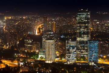 Fototapeta na wymiar Panoramic view of Providencia, Las Condes and Vitacura districts in Santiago de Chile at night.
