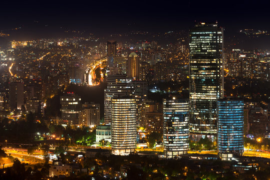 Panoramic view of Providencia, Las Condes and Vitacura districts in Santiago de Chile at night.