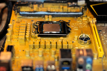 close up yellow color mainboard , motherboard in cpu computer . component of electronic circuit...
