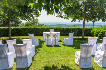 Table and chairs prepared for a wedding