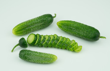 Fresh harvested homegrown cucumber from my garden isolated  on white background