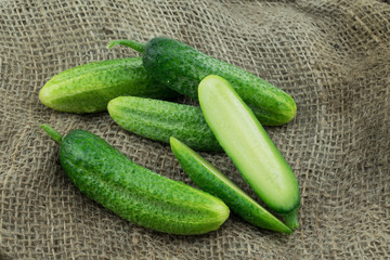 Fresh harvested homegrown cucumber  from my garden on jute background