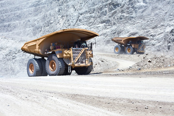 Huge dump trucks in an open pit Copper mine at northern Chile
