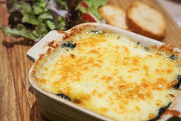 spinach lasagna with garlic bread and salad