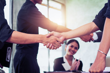 Business people shaking hands, finishing up a meeting