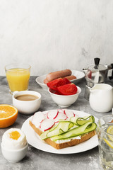 Various healthy breakfast on gray background