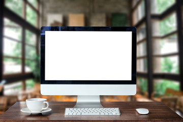 Computer Monitor, Keyboard, coffee cup and Mouse with Blank or White Screen Isolated is on the work table in the coffeeshop 