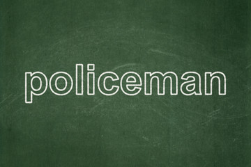 Obraz premium Law concept: text Policeman on Green chalkboard background