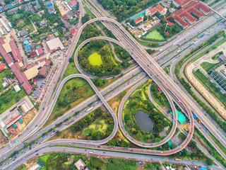 Fototapeta premium Of traffic on city streets in Thailand. Aerial view and top view Expressway with car lots.