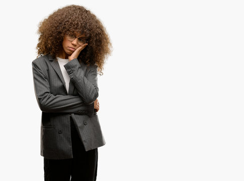 African american business woman wearing glasses thinking looking tired and bored with depression problems with crossed arms.