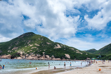 Naklejka premium Shek O, Hong Kong - June 25, 2018 : People enjoying sun shine at beach at sunny afternoon