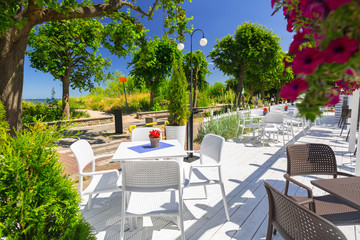 Beautiful white terrace in the garden by the sea