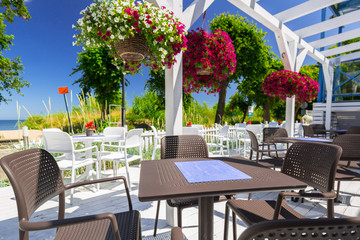 Beautiful white terrace in the garden by the sea