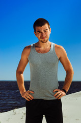 Fototapeta premium the guy with dark hair. bright sun light is blinding
