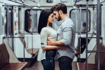 Young romantic couple in subway