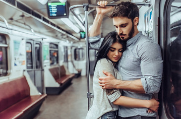 Young romantic couple in subway