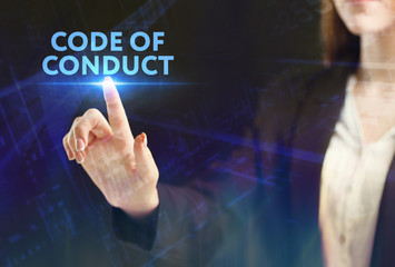 The concept of business, technology, the Internet and the network. A young entrepreneur working on a virtual screen of the future and sees the inscription: Code of conduct