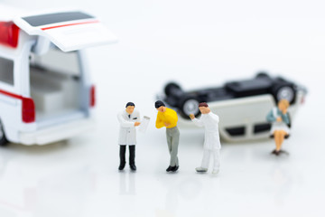 Miniature people : Injured personal from road accidents, ambulance transported to the hospital for treatment. Image use for not living on negligence.