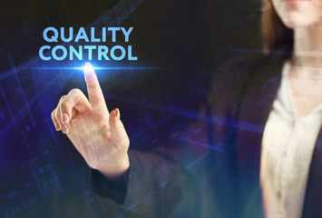 The concept of business, technology, the Internet and the network. A young entrepreneur working on a virtual screen of the future and sees the inscription: Quality control