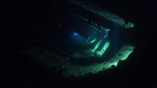Dark corridor inside the shipwreck with magical sun rays - Umbria, Sudan