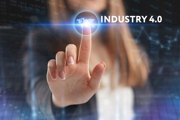 The concept of business, technology, the Internet and the network. A young entrepreneur working on a virtual screen of the future and sees the inscription: Industry 4.0