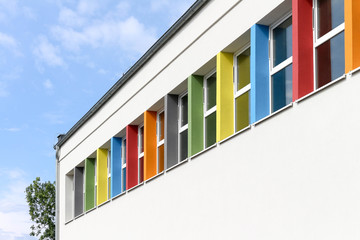 White sports hall with colorful pastel window frames