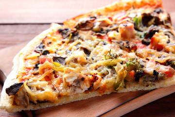 Pizza slices on a wooden board, Italian pizza on a wooden background top view, Italian food in vintage style, appetizing dish for summer vacation, American food, copy space, art