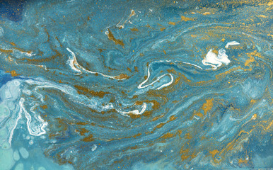Marble abstract acrylic background. Blue marbling artwork texture. Agate ripple pattern. Gold powder.