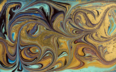 Marble abstract acrylic background. Blue marbling artwork texture. Agate ripple pattern. Gold powder.