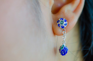 beautiful colorful earring on girl ear,silver  jewelry.