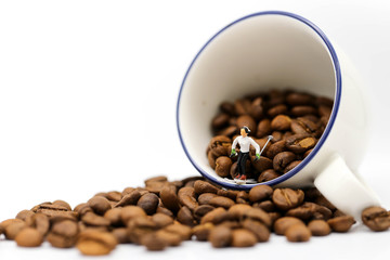 Miniature people :  Skiing On  coffee beans,relax concept.
