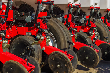 Mechanisms for the tractor are used for cultivating the land and planting seeds. Mechanization of agriculture.