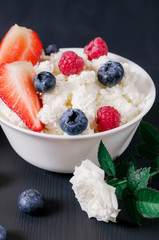 Useful breakfast, cottage cheese with strawberries, raspberries and blueberries