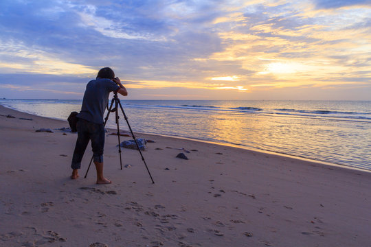 Photographer take the photo of the sea in sunrise time 