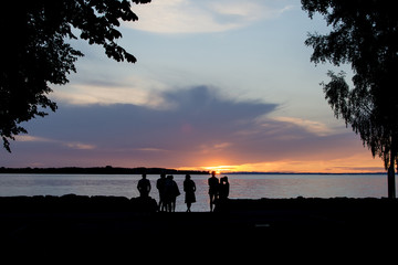Group of people watching the sunset.