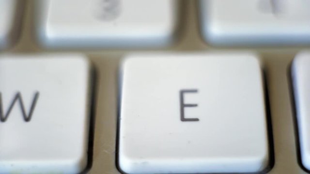 Keyboard with qwerty pan from left to right close up.