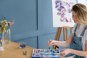 Fototapeta premium painting art classes. inspiration imagination. drawings creation. artist creating a watercolor painting