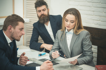 Business partners or businessmen at meeting, office background. Woman lawyer or accountant consulting entrepreneurs. Business consulting concept. Business negotiations, discuss conditions of deal